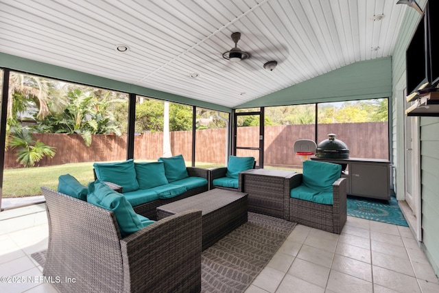 sunroom / solarium featuring ceiling fan and lofted ceiling