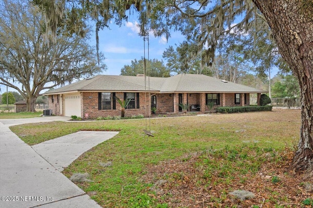 single story home featuring a garage, central air condition unit, and a front lawn