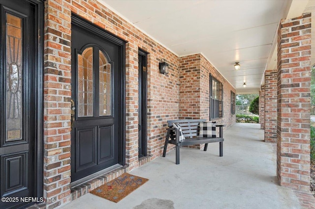 entrance to property featuring covered porch