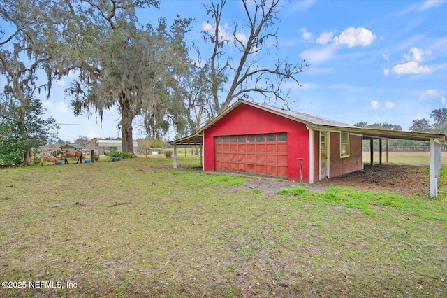 garage with a yard