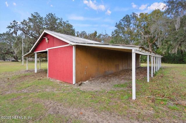 view of outdoor structure with a lawn