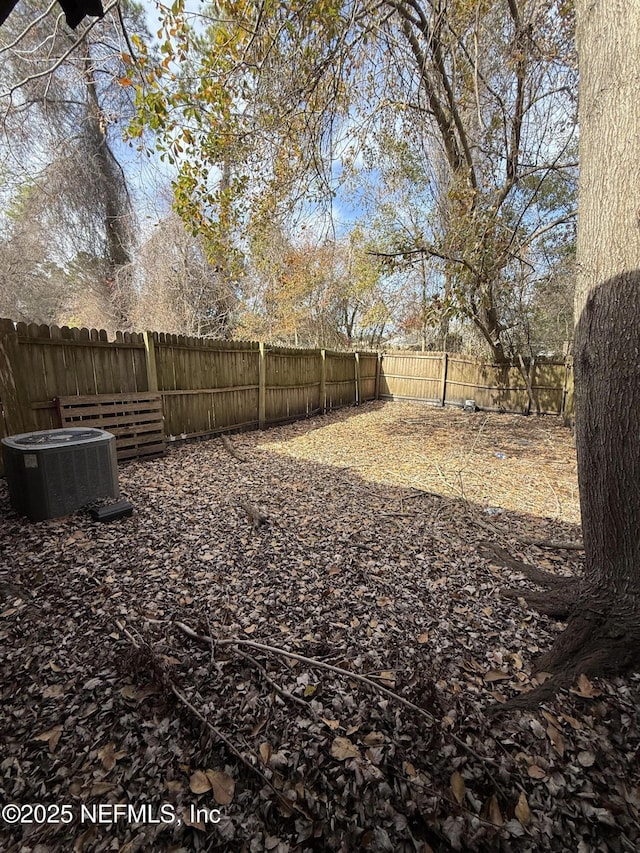 view of yard with central AC