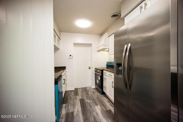 kitchen with custom exhaust hood, dark hardwood / wood-style flooring, stainless steel appliances, and white cabinetry