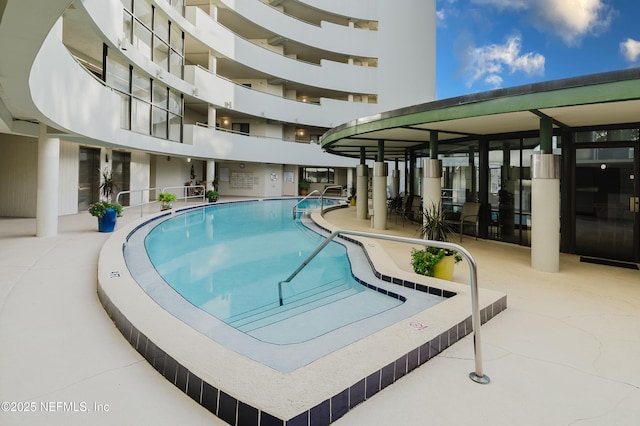 view of pool featuring a patio