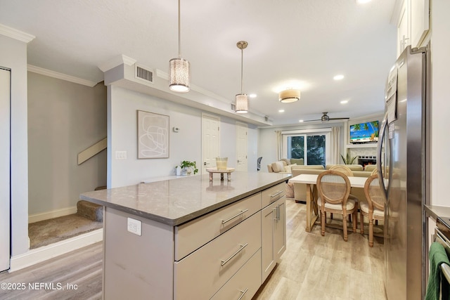 kitchen featuring light hardwood / wood-style floors, stainless steel fridge, decorative light fixtures, crown molding, and a center island