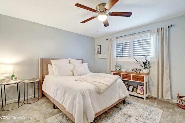 bedroom featuring light carpet and ceiling fan