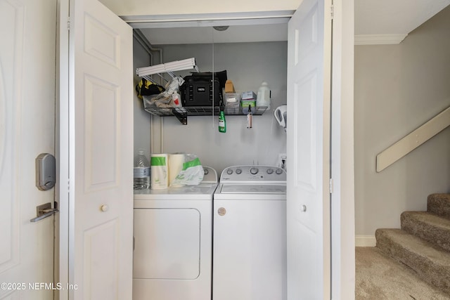 laundry area featuring light carpet and independent washer and dryer