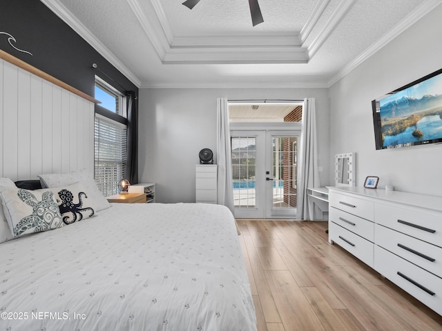 bedroom featuring french doors, ornamental molding, ceiling fan, access to exterior, and multiple windows