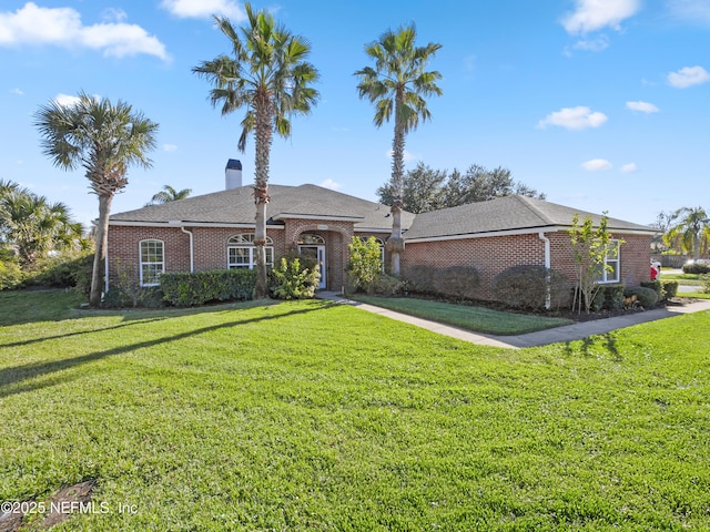 ranch-style house with a front lawn