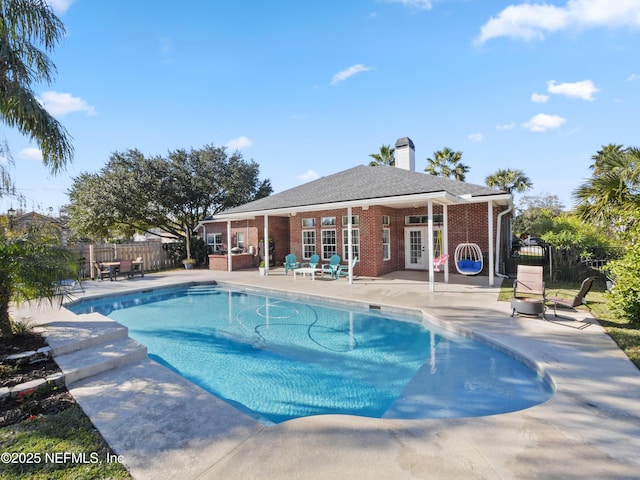 view of swimming pool featuring a patio area