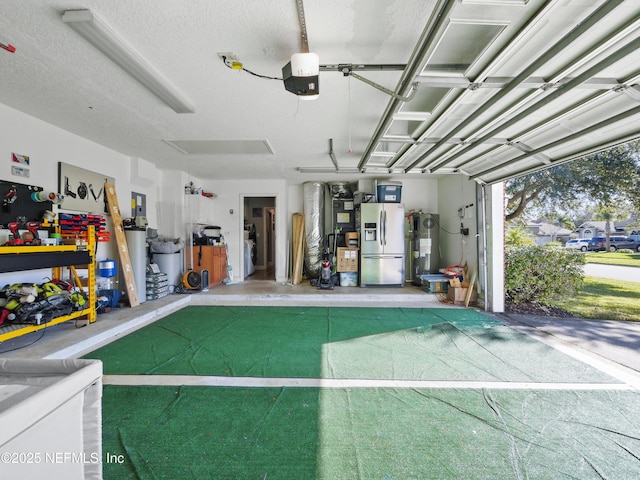 garage with water heater, a garage door opener, and stainless steel fridge