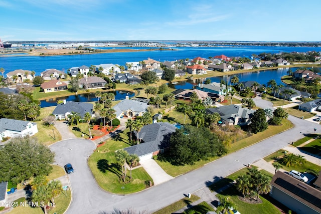 birds eye view of property with a water view