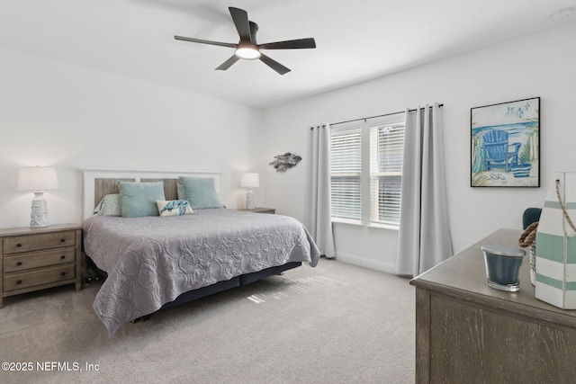 bedroom with ceiling fan and light colored carpet