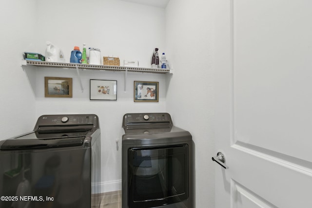 washroom with washer and dryer