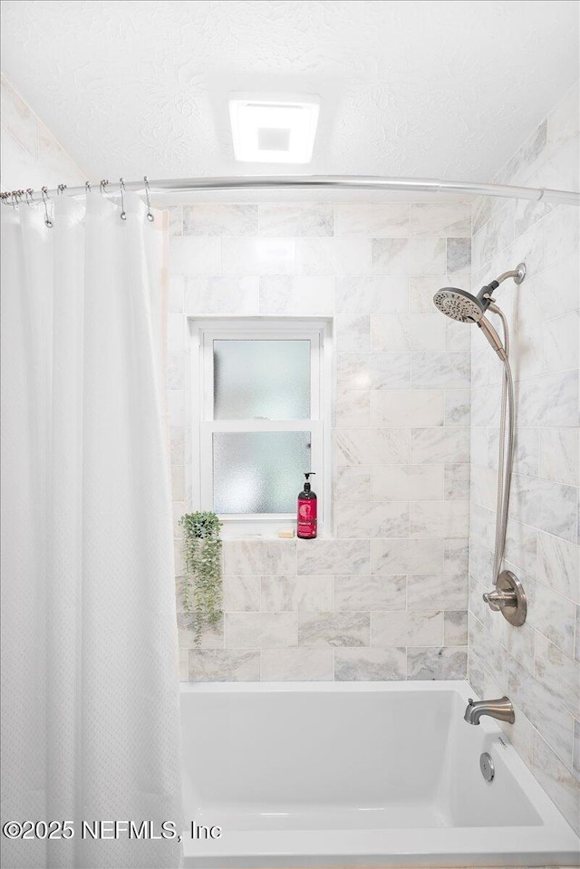 bathroom with shower / bath combo