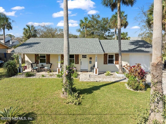 single story home with a garage and a front lawn