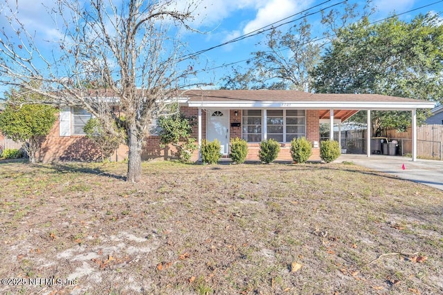 ranch-style house with a front lawn and a carport