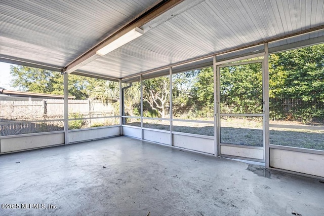 unfurnished sunroom with plenty of natural light