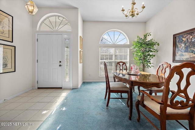 tiled dining space featuring a chandelier