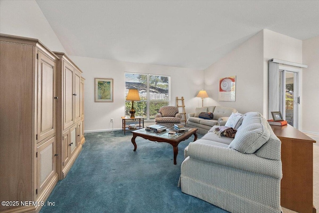 living room featuring vaulted ceiling and dark colored carpet