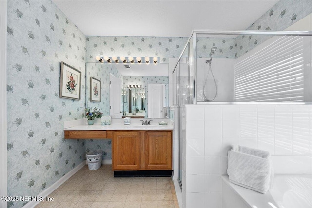 bathroom with a shower with shower door and vanity