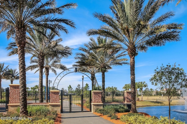 view of gate with a water view