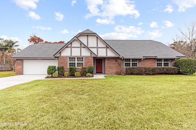 tudor home with a garage and a front yard