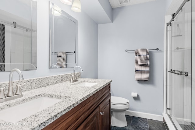 bathroom with a shower with door, toilet, tile patterned floors, and vanity