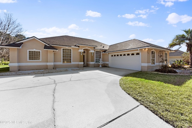 view of front facade featuring a garage and a front lawn