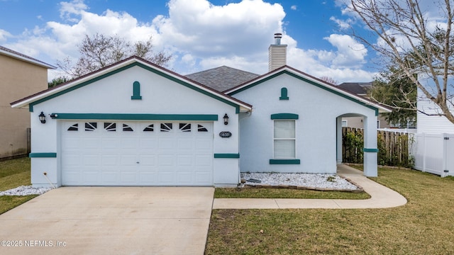 ranch-style house featuring a garage and a front yard