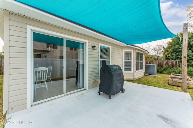 view of patio with a grill and central air condition unit