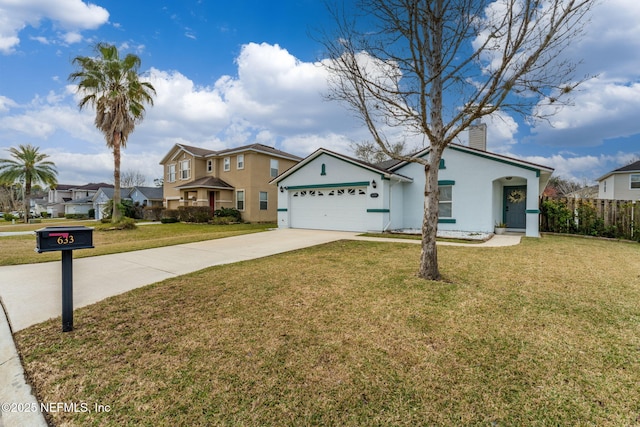 view of front of property with a garage and a front yard