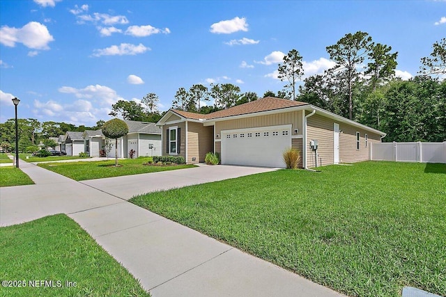 view of front of house featuring a front lawn and a garage