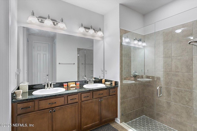 bathroom with an enclosed shower and vanity