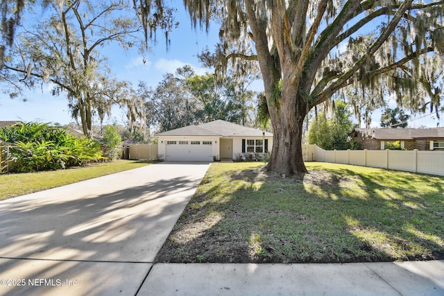 view of front of property with a front yard and a garage