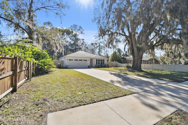 view of front facade with a garage and a front lawn