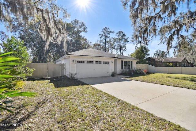 ranch-style home with a garage and a front yard