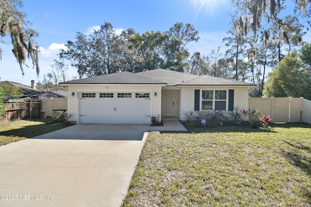 ranch-style house featuring a front yard and a garage