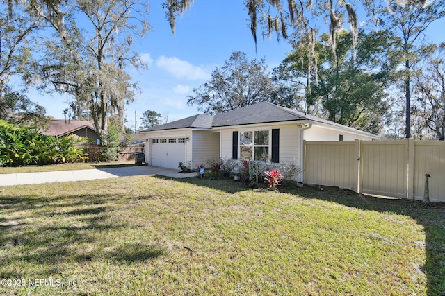 view of front facade featuring a garage and a front lawn