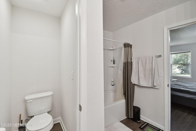 bathroom with hardwood / wood-style floors, toilet, and shower / tub combo