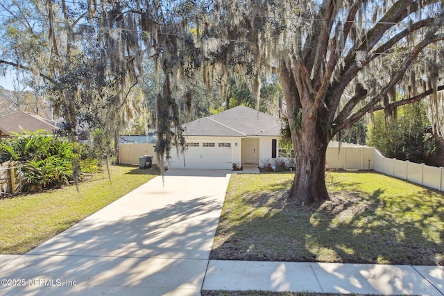 view of front of home with a garage and a front lawn