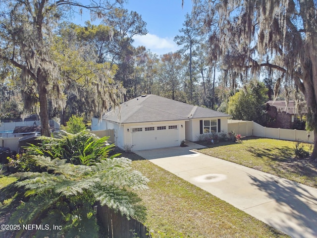 view of front facade featuring a front lawn and a garage