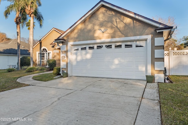 view of front of property with a front yard and a garage