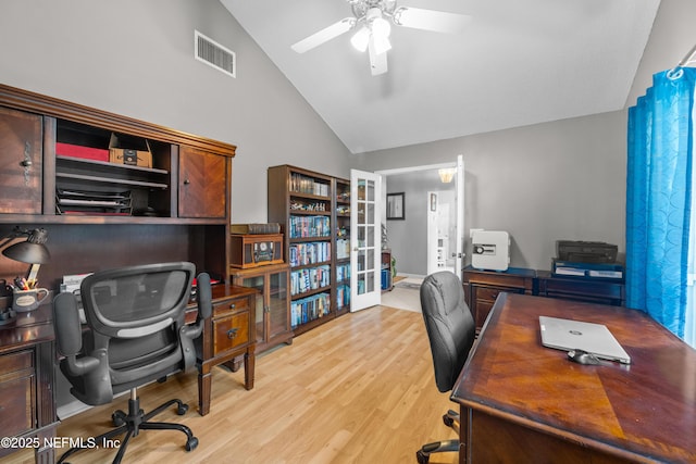 office with ceiling fan, light hardwood / wood-style floors, and vaulted ceiling