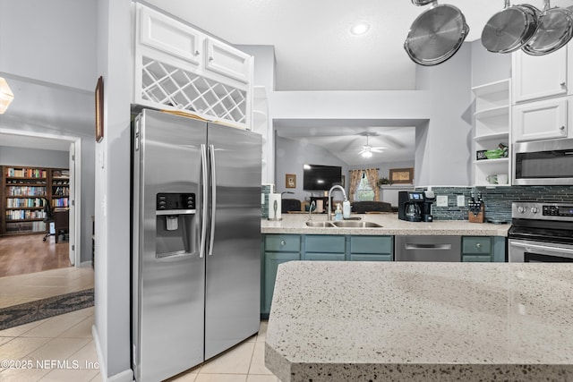 kitchen featuring white cabinets, light tile patterned floors, sink, and stainless steel appliances