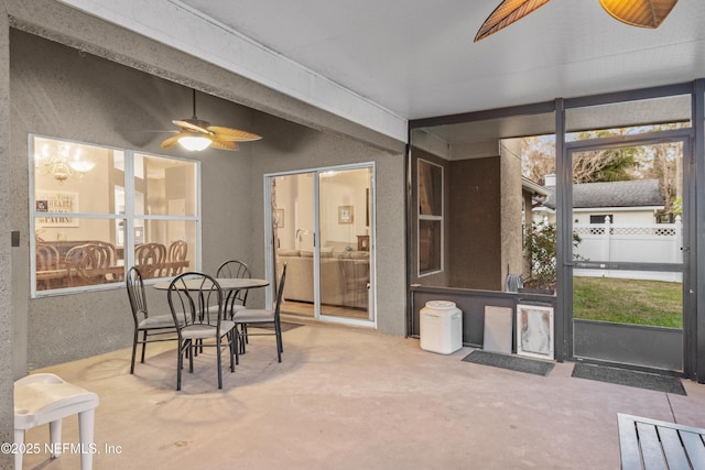 sunroom featuring ceiling fan