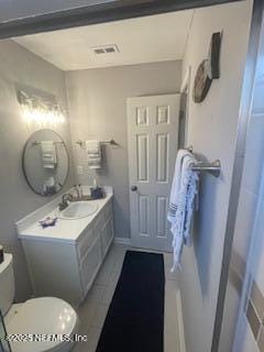 3706 Sanctuary Way N, Jacksonville Beach, FL 32250 - bathroom featuring vanity, toilet, and baseboards
