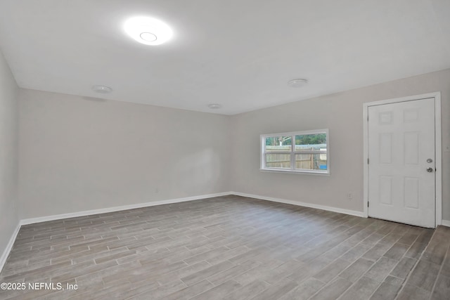 unfurnished room featuring light wood-type flooring