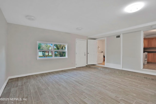 unfurnished living room featuring light wood-type flooring