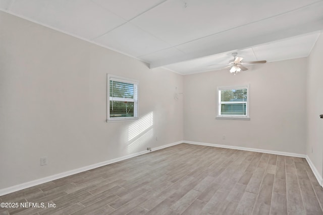 spare room featuring ceiling fan and light hardwood / wood-style floors